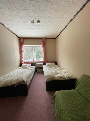 Ένα ή περισσότερα κρεβάτια σε δωμάτιο στο 夢冒険