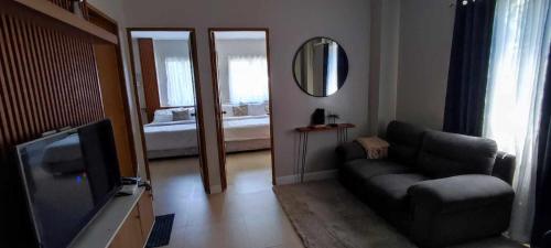a living room with a couch and a television at Cebu Park Residence Condominium in Cebu City