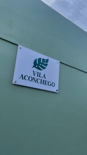 a sign hanging from the ceiling of a building at Vila Aconchego in Bragança
