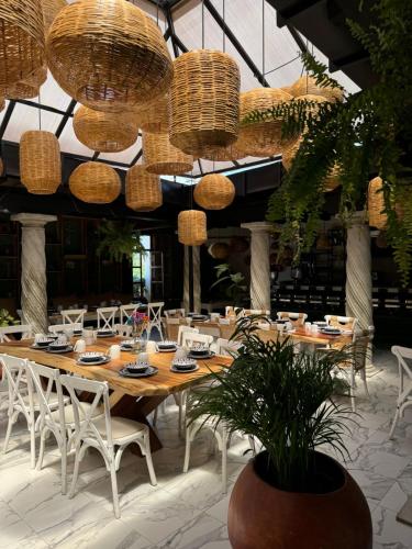a dining room with a long table and chairs at Departamentos San Francisco in San Cristóbal de Las Casas