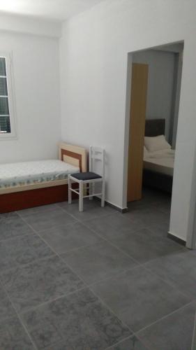 a room with two beds and a mirror at Guest House Solive in Himare