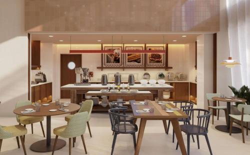 a rendering of a restaurant with tables and chairs at Hampton By Hilton Santiago De Los Caballeros Monument in Santiago de los Caballeros