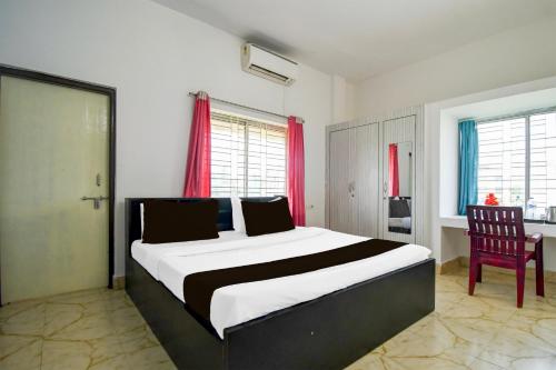 Postel nebo postele na pokoji v ubytování Super Hotel O Dumduma Near DN Regalia Mall