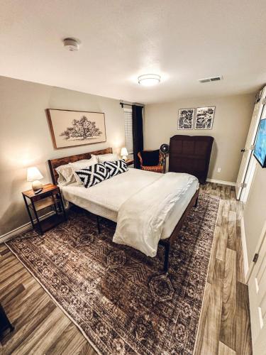 a bedroom with a large bed and a rug at Bradshaw Sunset RV Park N Apartment Springtown TX in Springtown