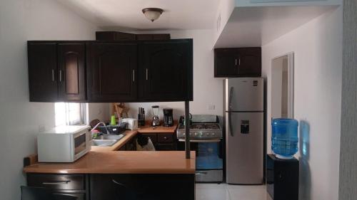 Η κουζίνα ή μικρή κουζίνα στο House in a gated community