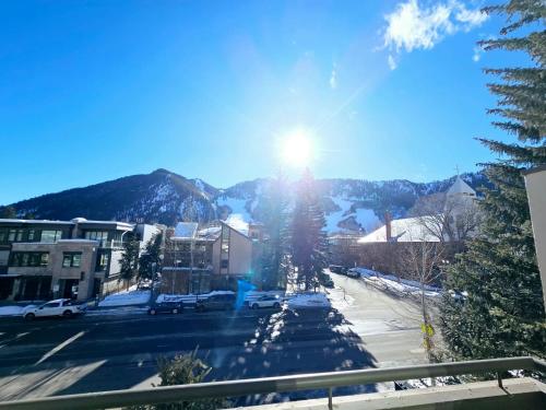 a view of a street in a town with the sun shining at New Listing Renovated 2 BR Aspen Condo in Aspen
