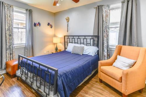 a bedroom with a bed and a chair at 5 Mi to French Quarter NOLA Getaway with Patio! in New Orleans