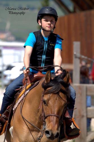 a woman riding on the back of a horse at Oberprantschöllhof - Horse Mountain Stable in Bressanone