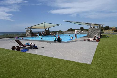 a group of people in a swimming pool at White Sands Estate in Falmouth