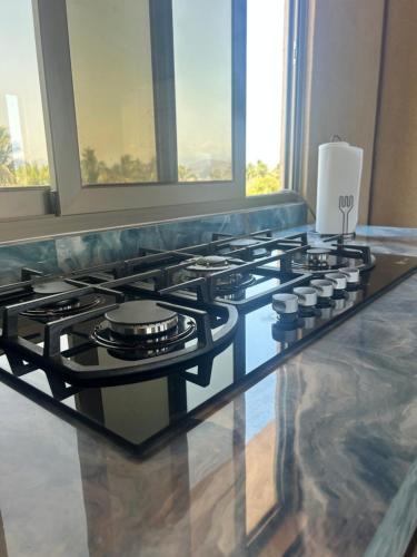 a stove top oven sitting on top of a counter at Condominio Agave del Mar in Coyuca