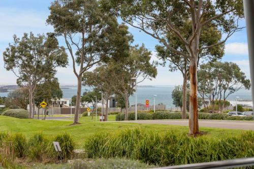 a park with trees and the ocean in the background at Silverwater Jewel in San Remo