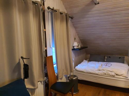 Postel nebo postele na pokoji v ubytování Bergvegur 7