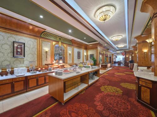 a large bathroom with two sinks in a room at Shanghai Park Hotel - Hudec Excellent Historical Building - Priority Access for Classic Butterfly Cookies Without queuing to guests in Shanghai