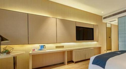 Katil atau katil-katil dalam bilik di Echarm Hotel Liuzhou High-speed Railway Station