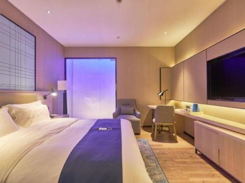 Katil atau katil-katil dalam bilik di Echarm Hotel Liuzhou High-speed Railway Station