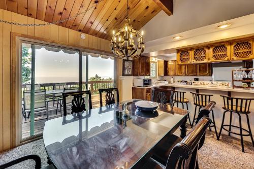 a kitchen and dining room with a table and chairs at Stunning Deck Views Cozy Running Springs Cabin in Running Springs