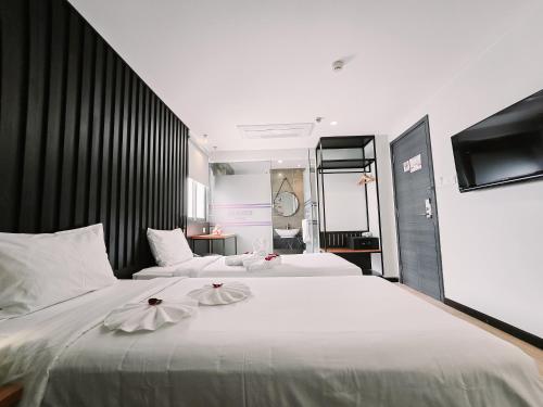 Letto o letti in una camera di Hermes Hotel Nha Trang