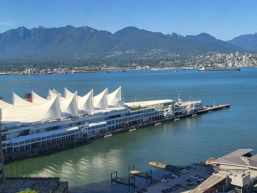 a large building with white roofs on a body of water at Downtown Center Silverstone Tower I and II Long-Term Booking Only Your second home in Vancouver in Vancouver