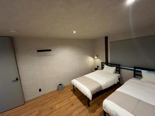 Katil atau katil-katil dalam bilik di AWAJI OCEAN BASE east coast