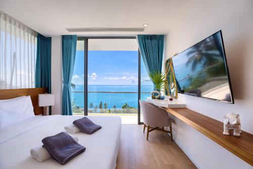 Μια τηλεόραση ή/και κέντρο ψυχαγωγίας στο Villa The Wave 2 Residence