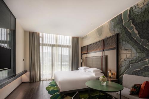 Ένα ή περισσότερα κρεβάτια σε δωμάτιο στο Hotel Indigo Nanjing Garden Expo by IHG