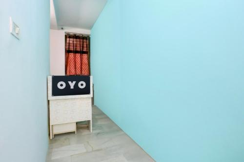 a view of a room with a tv on a wall at Super Hotel O Dream Palace in Delhi