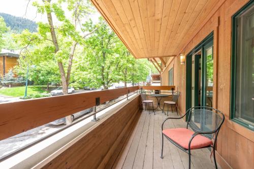 a porch with chairs and a table and a window at New Listing 3 BR 3 BA Aspen Condo near Gondola in Aspen