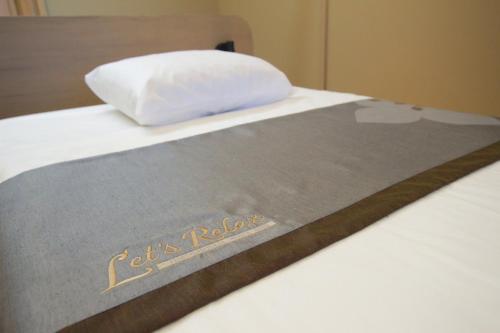 Katil atau katil-katil dalam bilik di LePont Riverfront Resort Nongkhai