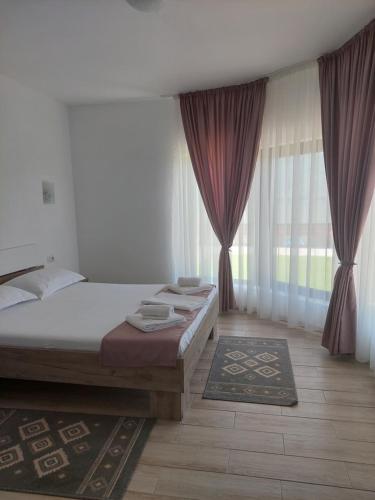 Ένα ή περισσότερα κρεβάτια σε δωμάτιο στο Casa FAVORIT
