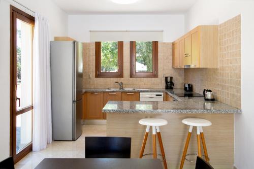 Kuchyň nebo kuchyňský kout v ubytování Aphrodite Hills Rentals - Superior Villas