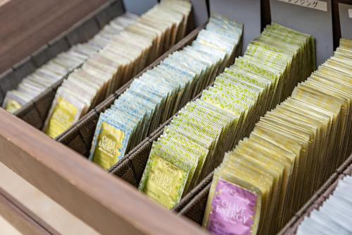 a bunch of ties sitting in a drawer at HOTEL MYSTAYS Kanazawa Katamachi in Kanazawa