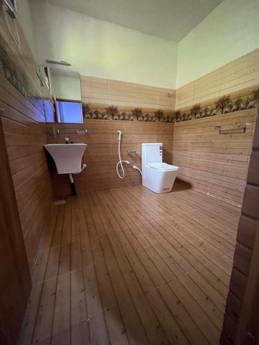 a bathroom with a sink and a toilet at Luma Residence Anuradhapura in Anuradhapura