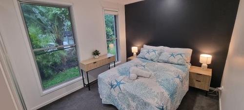 Ένα ή περισσότερα κρεβάτια σε δωμάτιο στο St Bees Retreat Airlie Beach