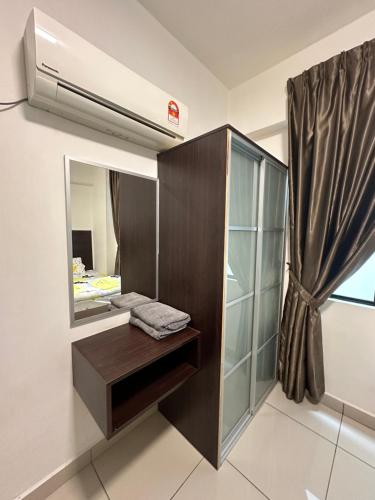 a bathroom with a sink and a mirror at Homestay in Marina Heights with beach view in Lumut
