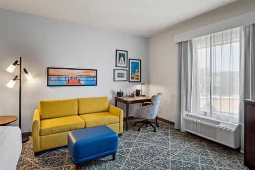 a living room with a couch and a table at Hampton Inn and Suites Trophy Club - Fort Worth North in Trophy Club
