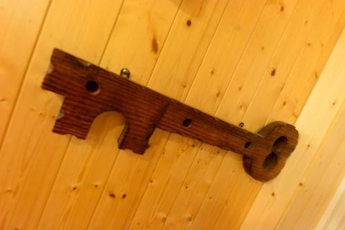 a wooden object is hanging on a wall at 寧靜の家A區14人Villa專暑獨棟隱私無憂 in Hengchun