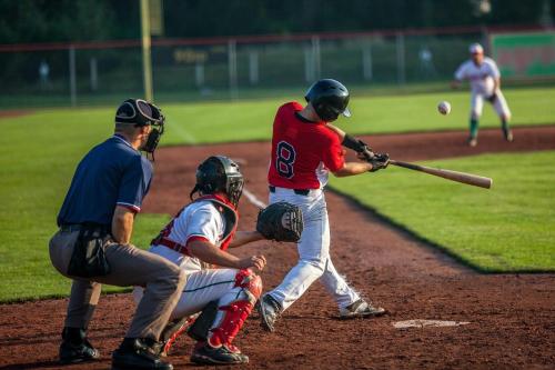 a baseball player swinging a bat at a ball at Cambria Hotel Davenport Quad Cities in Bettendorf