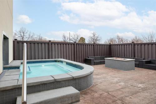 a hot tub on a patio next to a fence at Hampton Inn And Suites Logan, Ut in Logan