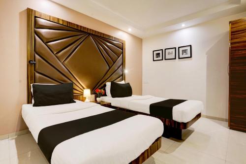 Кровать или кровати в номере Super Hotel O Mumbai Central Formerly Park Palace