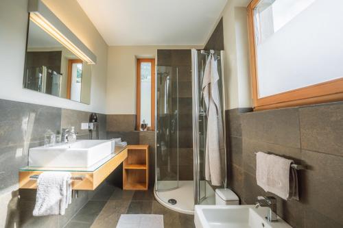 a bathroom with a sink and a shower at Apartment Egghof im Weingut in Merano