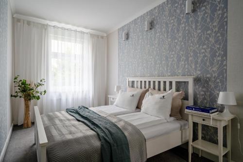 Posteľ alebo postele v izbe v ubytovaní Twoje Miejsce przy Plaży - Parkowa 33A2 by Lion Apartments Sopot
