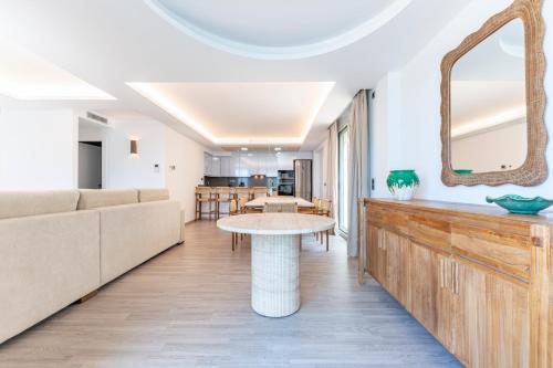 a living room with a couch and a table at Montiboli Apartments by Buccara in Villajoyosa