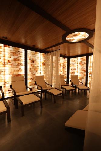 a waiting room with chairs and a light at GasthauS & SPA in Bukovel