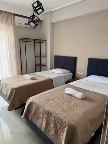 Ένα ή περισσότερα κρεβάτια σε δωμάτιο στο Lia Rooms