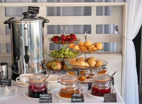 a display of different types of bread and fruit at Villa Four Rooms in Kharkiv