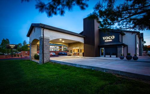 a building with a vco sign on the front of it at voco Flagstaff by IHG in Flagstaff