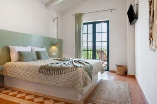 Ένα ή περισσότερα κρεβάτια σε δωμάτιο στο Anogia villas