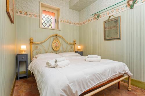 Giường trong phòng chung tại Storica Villa Taormina