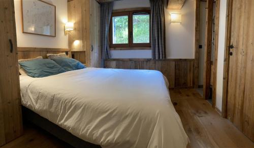 Ένα ή περισσότερα κρεβάτια σε δωμάτιο στο Chalet Les Martin's 1