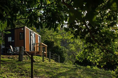 a tiny house sitting on top of a hill at Guanaba Farm by Tiny Away in Eagle Heights